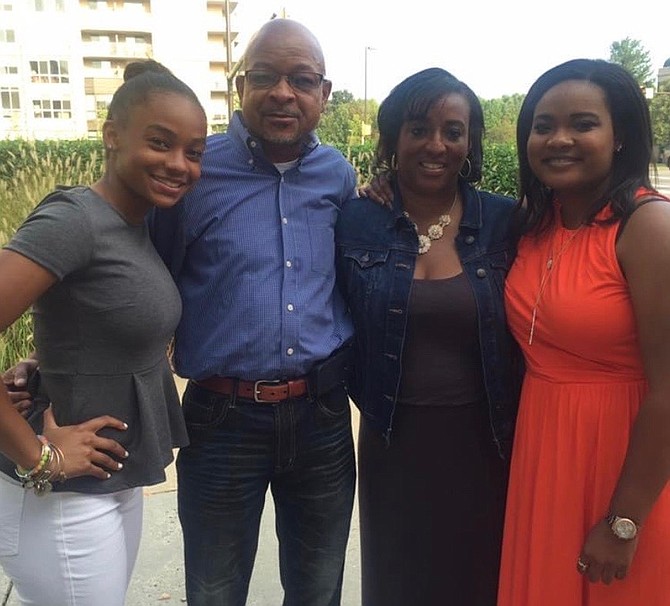 Third from left, Samantha Whitfield, with daughter Maya, husband Milton and daughter Amani.