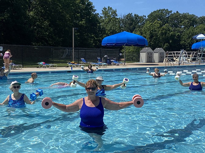 On opening day, June 29, the water aerobics class is underway in the cool waters of Lake Newport pool operated by Reston Association.