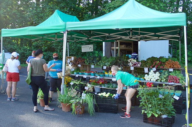 Garner’s Produce has their table set up to still allow customers to browse all their produce options; but to prevent contact and promote social distancing, workers place all the customers’ items in a basket, which are then placed on a table for the customer to bag up and pay.