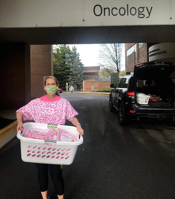 Elise Yanker Hasenei dropping off a donation of glam hospital gowns at Virginia Hospital Center.