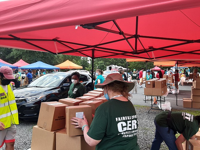 County groups volunteered to hand out food in the Journey Church parking lot last week.
