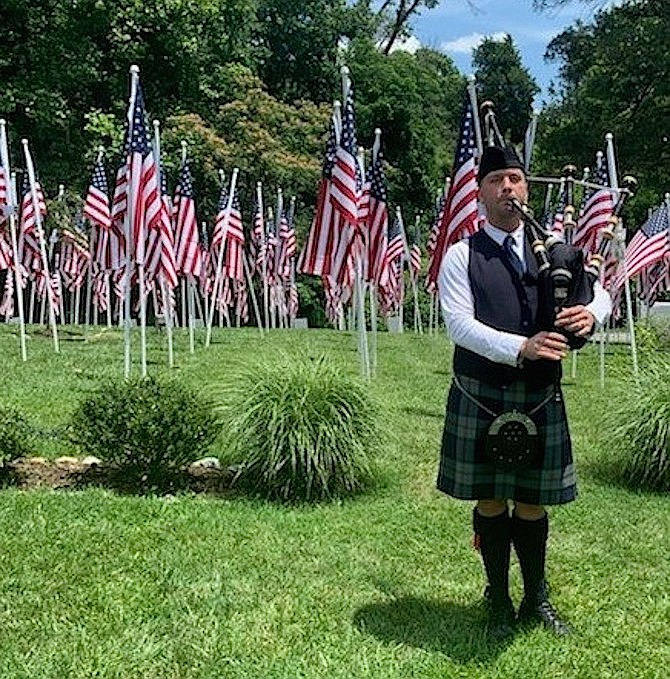 Bagpiper Adam Tianello performs Amazing Grace at the Flags for Heroes display June 28 at Cedar Knoll Restaurant.