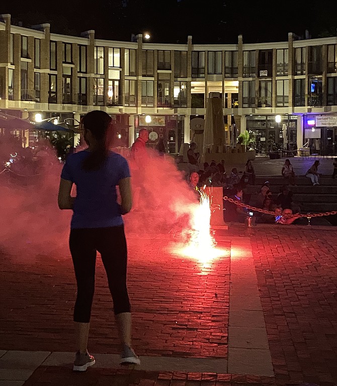 A fountain firework colors Lake Anne.