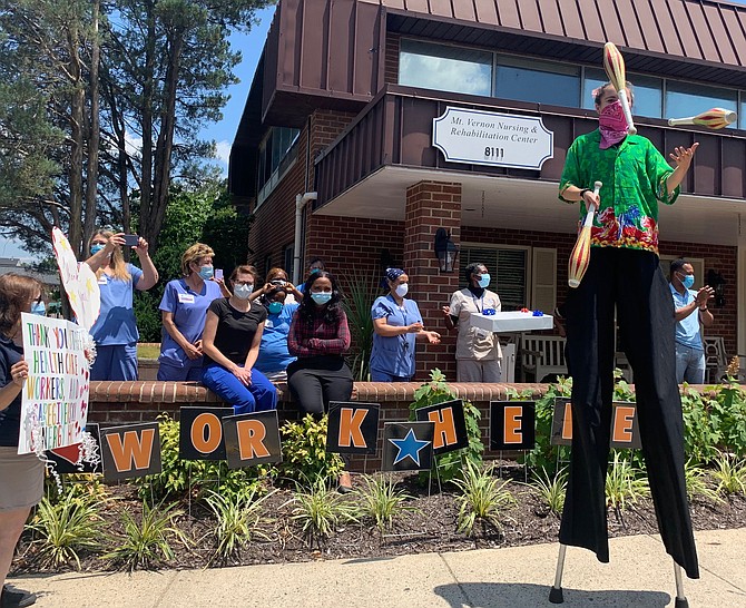 Mount Vernon Nursing and Rehabilitation Center staff watch a juggler brought to the facility June 30 by Synergy Home Care in a show of appreciation for their dedication during the COVID-19 pandemic.