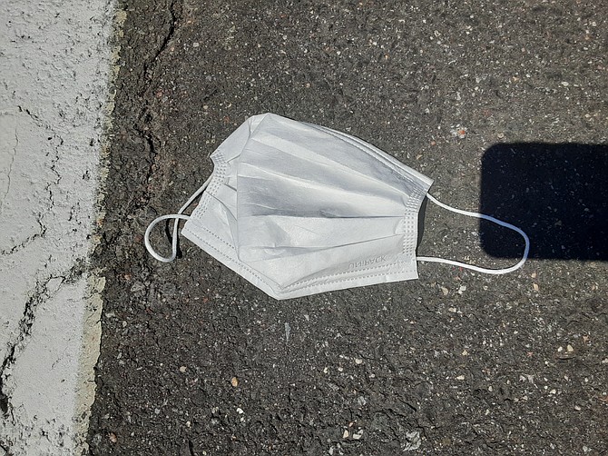 Throwing away PPE in the trash can is not that hard, but some is ending up in parking lots.