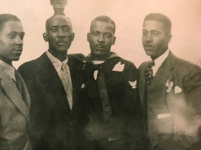 Norman Roy, Sr., second from the left, with his sons.