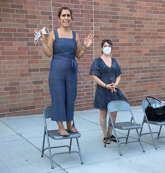 Outgoing Potomac Elementary School PTA President Golru Ghaffari opens the group’s first ever outdoor meeting Thursday. To her left is President elect Susana Zhuo.