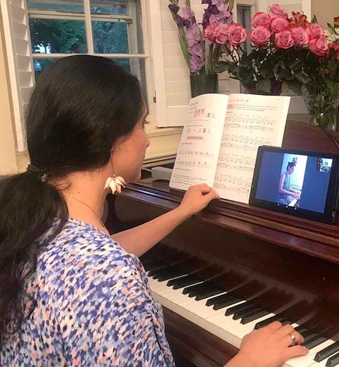 Kristina Markarian teaches piano online by Zoom from her studio in McLean.