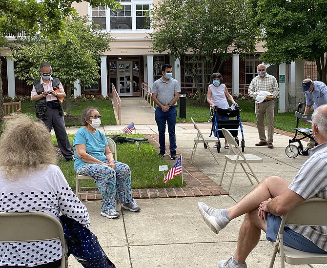 Residents at Herndon Harbor House, an independent living complex for seniors, listen as Pradip Dhakal, Town of Herndon Candidate for Councilmember, explains his goals for 2021-2022.