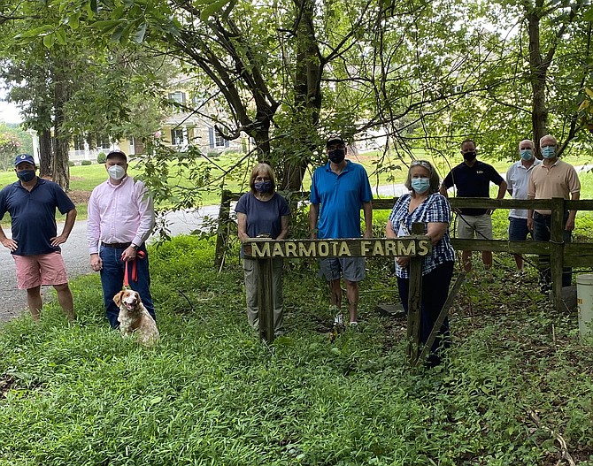 (From left) Robb Watters, Scott Knight and Huey, his dog,  Jinny Beyer, Sean Beyer, Jennifer Falcone, Great Falls Citizens Association Land Use & Zoning Committee, Patrick O’Connor, Skip Dawson and  Bill Canis, President of Great Falls Citizens Association. (Not pictured: Mr. and Mrs. Carlson.)