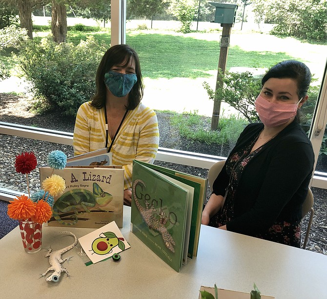 From left: Great Falls Library Branch Manager Andrea Spira and Youth Services Manager Devin Parris pose with craft kits.