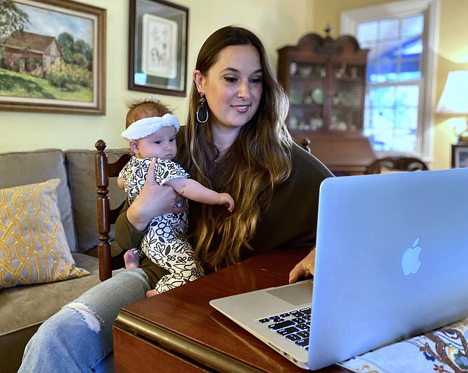 After delivering her daughter Zosia at Fairfax Hospital in January 2020, Alexa Landry of Reston consults with an Internationally Board Certified Lactation Consultant through Arrow Birth's website.