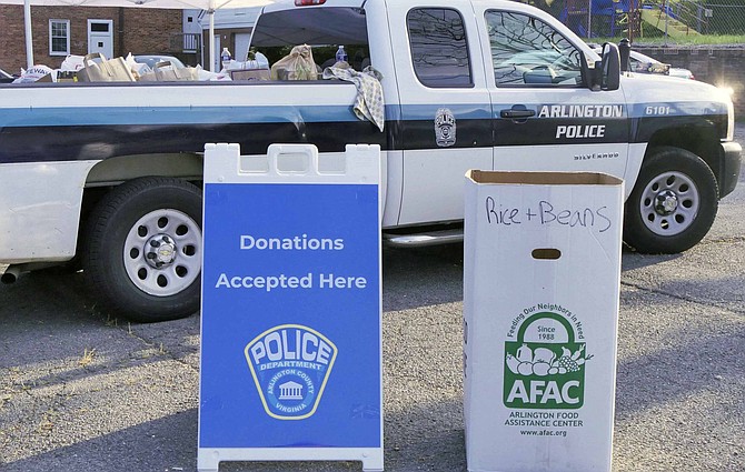 Arlington County Police Department holds “Fill the Cruiser” food drive for Arlington Food Assistance Center on Aug. 11.