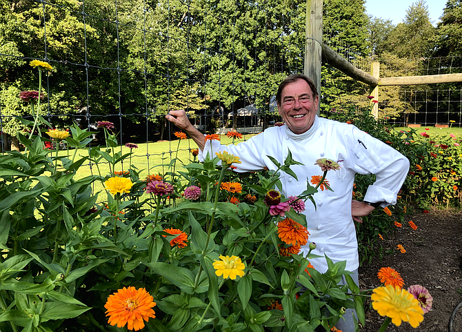 L’Auberge owner and chef Jacques Haeringer stands in the restaurant’s garden.