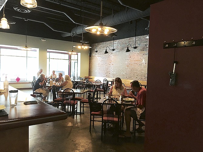 The charming dining room of River Bend Bistro showcases the menu of local chef Caroline Ross, who owns the restaurant at 7966 Fort Hunt Road with her husband Bill Ross.