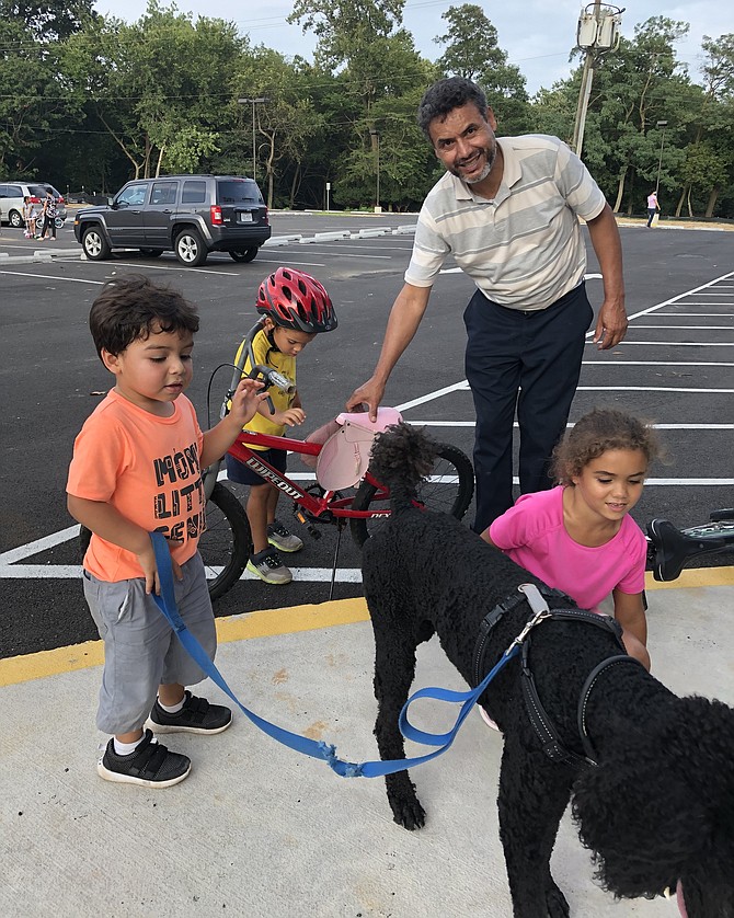 Sometimes it is hard to tell who is having more fun at the park, the kids or the grandparents. In this case, it was a toss up.  Grandfather “Papí” (Elvis) Melo instructed the kids on their bikes and then took off for a victory lap around the park to enjoy the pristine blacktop for himself.