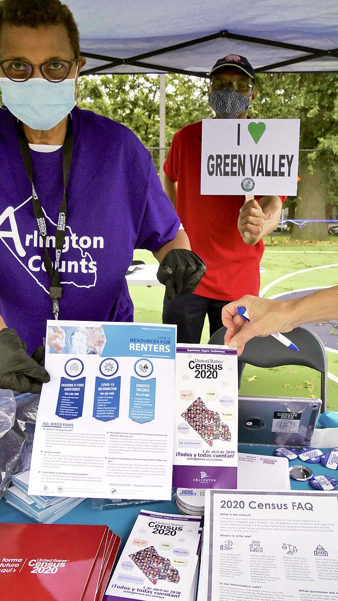 Joann Griffin and Ahmed Scego man a census information table at the Arlington Census Palooza event held at Charles Drew Community Center on Saturday, Sept. 12.