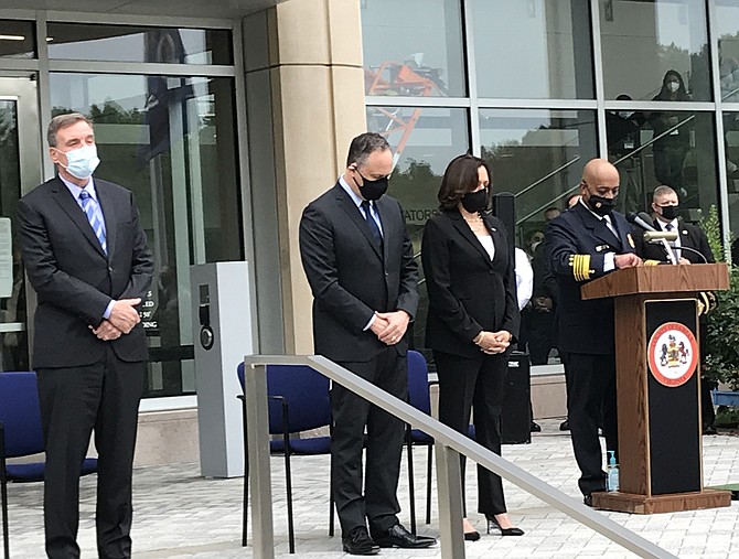 (From left) U.S. Sen. Mark Warner (D-Va.); Douglas Emhoff;  Democratic Vice Presidential candidate, U.S. Sen. Kamala Harris  (D-Calif.); and Fairfax County Fire Chief John S. Butler bow their heads in a moment of silence.