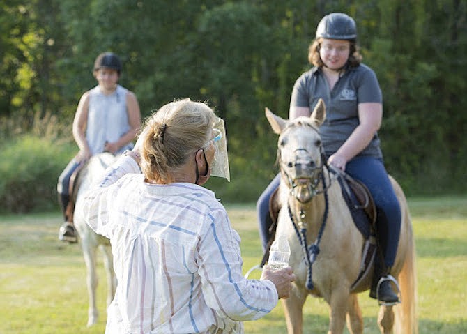 Dada Suvak of Reston instructing Nicole Springer (Sterling), during her riding lesson at Spirit Equestrian in Frying Pan Park in Herndon.  Suvak is founder and director of Spirit.