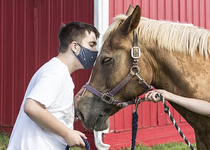 Jimmy Kirkland reuniting with "Monkey Business," or as he is inexplicably nicknamed, Pierre, at Northern Virginia Therapeutic Riding Program in Clifton.