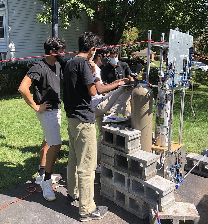 Several Project Caelus members perform a final systems check moments before the cold flow test.