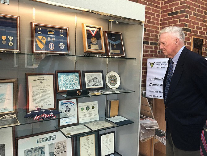Captain Eugene “Red” McDaniel, brutally tortured as a prisoner of the Vietnam War, looks at the display honoring Alexandria’s POW/MIA veterans during a 2019 visit to the Rocky Versace Plaza and Vietnam Veterans Memorial at the Mount Vernon Recreation Center.