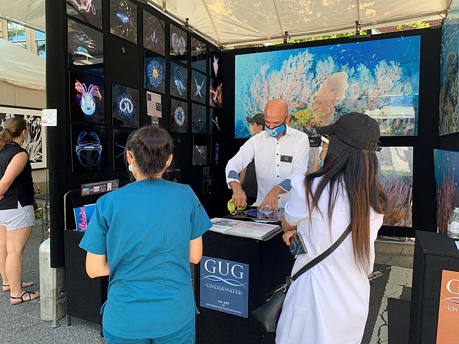 Chris Gug of Gug Underwater Photography displays his work Sept. 12 at the 18th annual Alexandria Old Town Arts Festival.