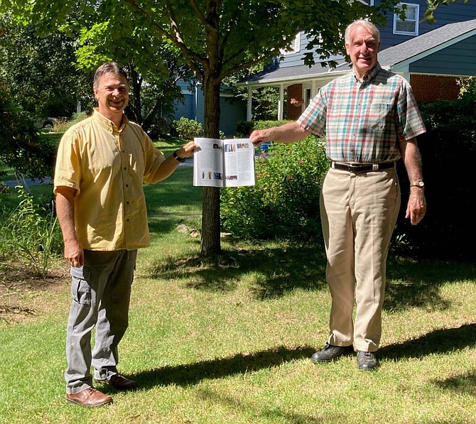 Brent Steury, left, and James (Jim) Sherald, right, socially distanced and holding the journal article that described the new soldier beetle species named in Jim’s honor.