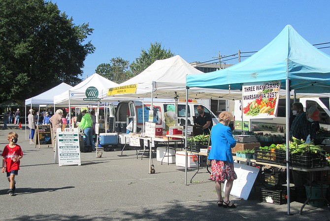 Vendors set up tents and tables every Wednesday by 8 a.m.