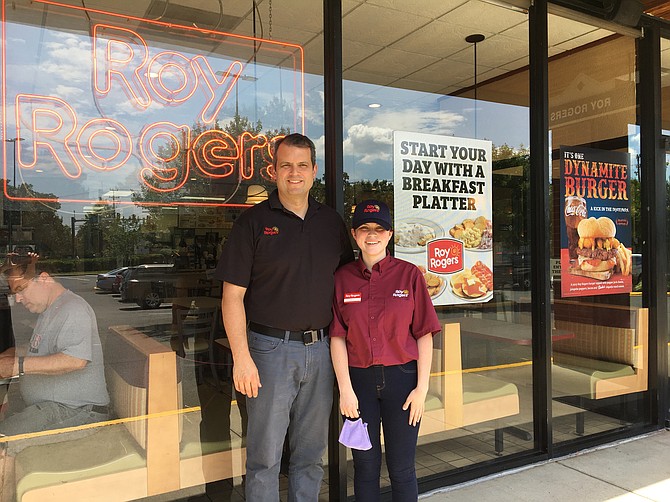 Jason Hunt and his daughter Delia welcome customers to the Manchester Lakes Roy Rogers Restaurant.