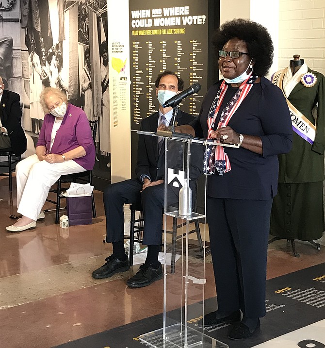 Fairfax History Commissioner Anne Barnes participating in celebration of the Year of the Woman with the 100th Anniversary of Women’s Right to Vote at the Lucy Burns Museum at the Workhouse Arts Center.