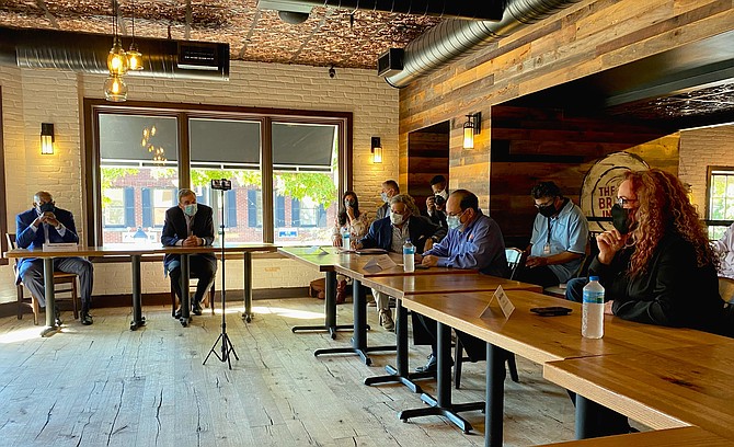 Sen. Mark Warner (D-VA), second from left, meets with local restaurant owners Oct. 5 at Hen Quarter on King Street to discuss ways Congress can help the food service industry and its employees.