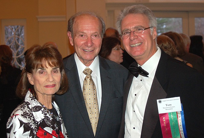 Bernard Cohen, center, with his wife Rae and law partner Tom Curcio, at the Virginia Trial Lawyers Association convention in 2014.