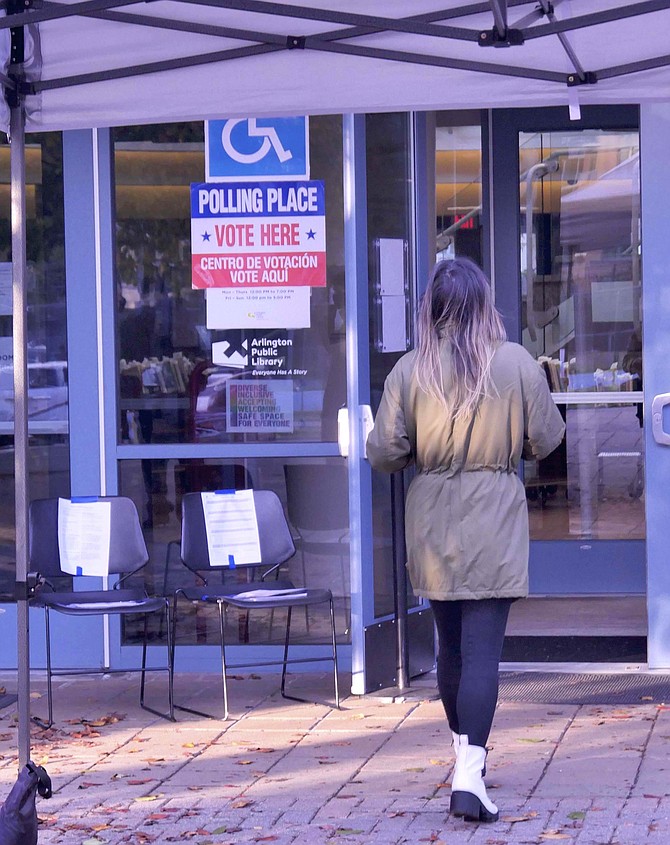 A line of Arlingtonians waited to vote at the Central Library at 6 am when the polls opened, but by 7:30, it had slowed down to a steady flow of one-to-two voters at a time.