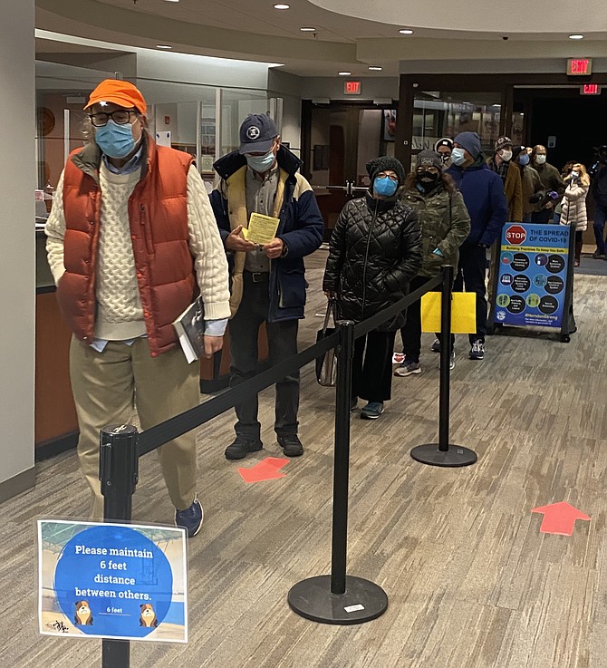 Voters line up well before dawn on Election Day 2020, Tuesday, Nov. 3 in the Dranesville District of Fairfax County at Precinct 320, Herndon #2, Herndon Community Center.