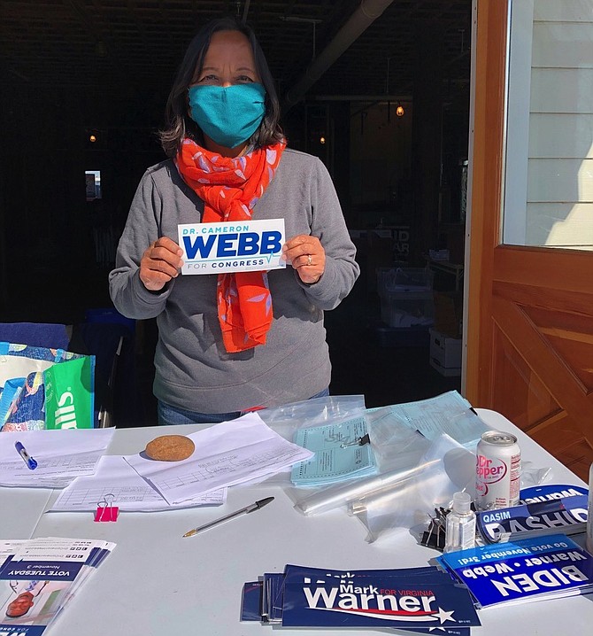 Rose Fabia, manning the volunteer desk in Warrenton last weekend. Fabia sent canvassers out to “get out the vote,” 40 houses at a time, in an area of farms and large housing developments. Along with other volunteers in Arlington, she had spent the last month phone banking for Dr. Cameron Webb, who is running for Congress in Virginia’s 5th District.