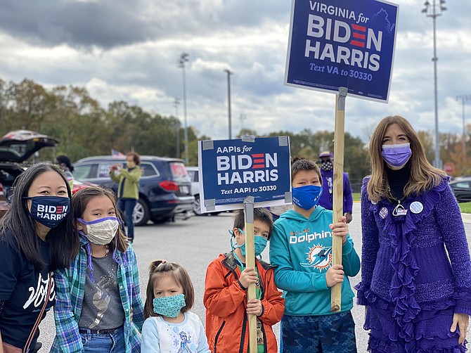 Delegate Kathy Tran, here with her children, and Virginia House Speaker Eileen Filler-Corn, spoke before the car parade rally.