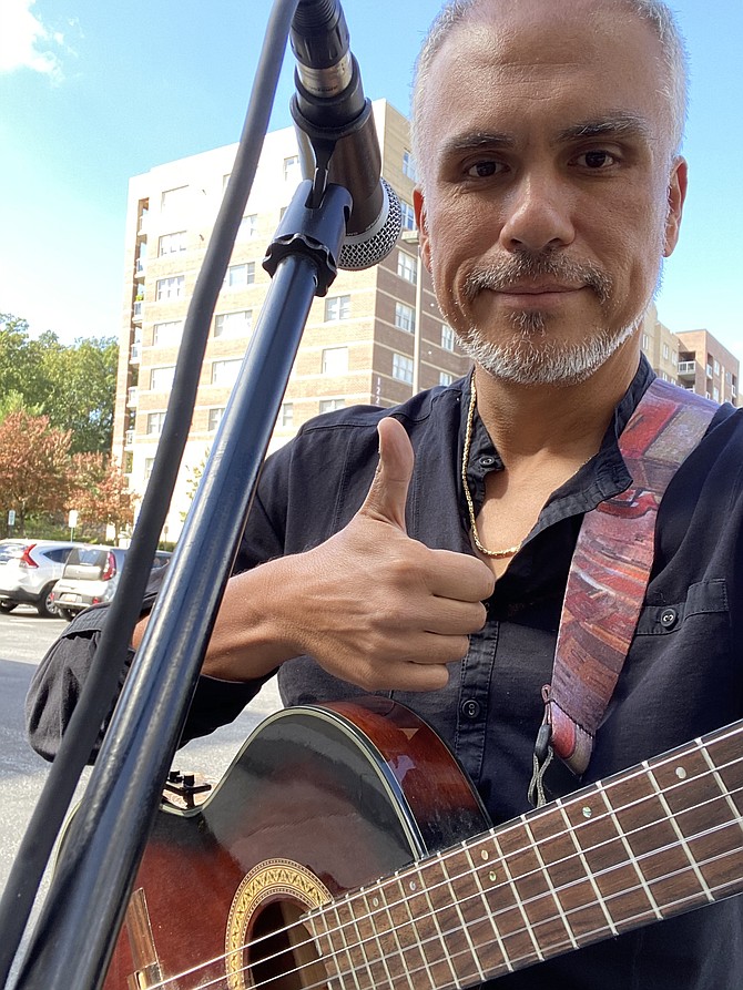 Jose Sacin performing outdoor concert for seniors in Baltimore.