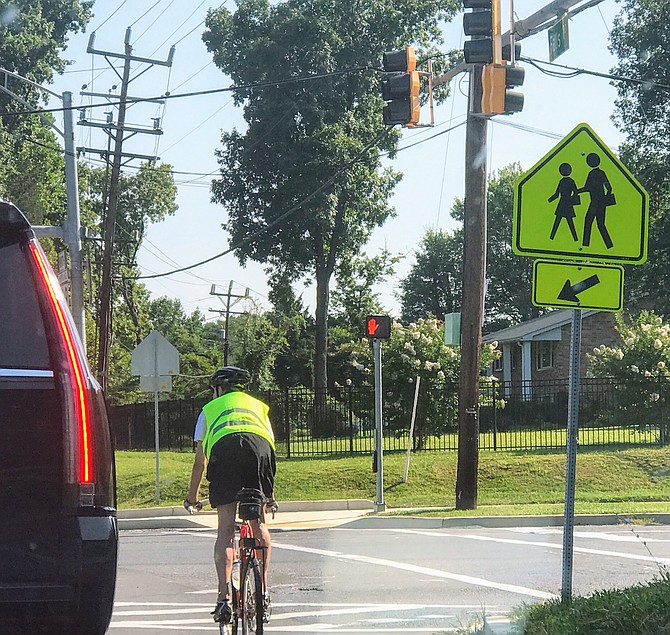 A bicyclist at Falls Road and Tuckerman Lane. A virtual hearing on Nov. 12, 2020, at 6:30 p.m. will focus on planning a future bike lane on Tuckerman Lane from Falls Road to Snakeden Branch.