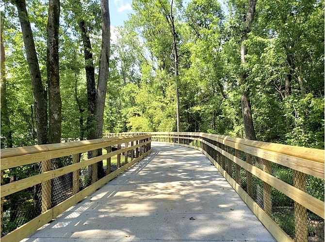Example of a trail section with a boardwalk and railings.