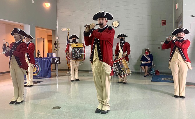 The Historical Trumpets and Flutes of the United States Army Old Guard Fife and Drum Corps perform a musical interlude for the attendees of the Veterans Day program Nov. 11 at Blessed Sacrament School Hall.
