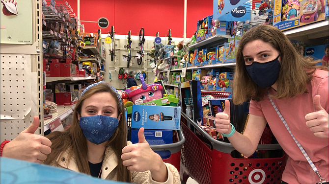 Anna Bartlett (left) and Lauren Rosenthal, Yorktown High School students, on a buying spree at Target for children at Doorways.