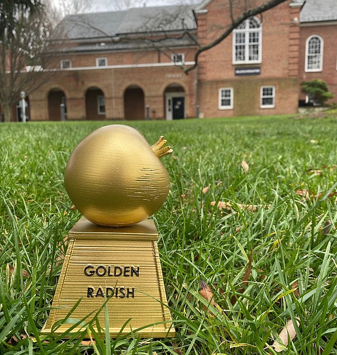 The Golden Radish Award is displayed in the yard outside of Rock Spring United Church of Christ on Little Falls Road in Arlington, where church space was donated through the spring and summer for volunteers to bag vegetables to be distributed to food insecure neighbors.