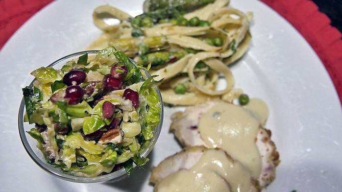 One diner has received their Mindy’s dinner order of cordon bleu, brussels sprouts slaw and fettuccine with asparagus and peas. They will save the potato leek soup and cheddar biscuits for tomorrow’s lunch.
