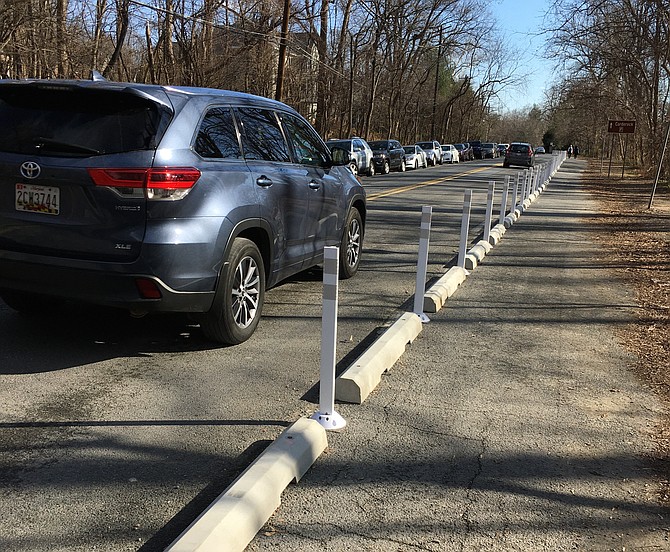Temporary barriers were put in place on the south side of MacArthur Boulevard between Anglers Inn and Brickyard Road in late November. The barriers separate bicyclists and pedestrians from traffic and prevent parking along that side of MacArthur.