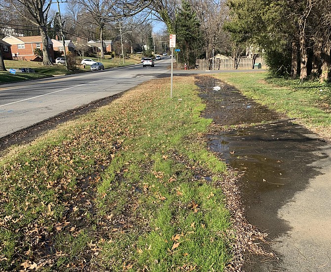 At Fort Hunt Road and I Street, this water seep brings wet shoes and questions for those walking the streets for a breath of fresh air.