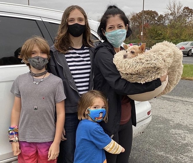 Mary Carter holding Bella, with her children Jackie (left), Chloe and Hugo Christian.