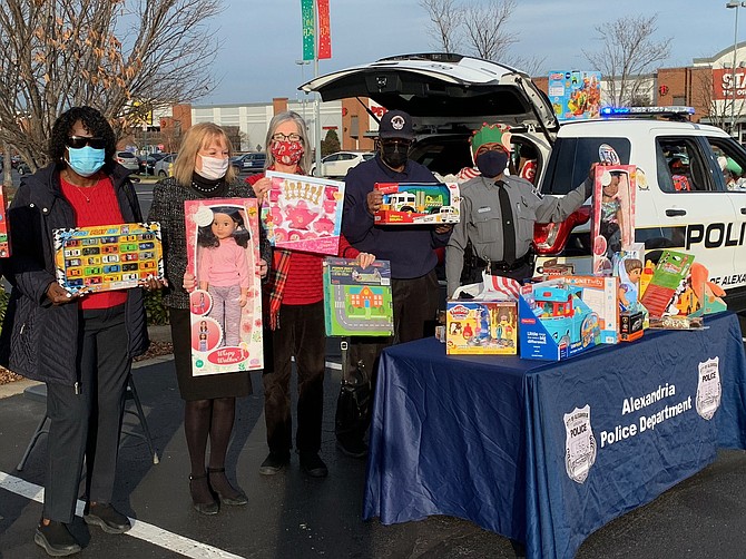 The Commonwealth Republican Women's Club supported the Alexandria Police Department's toy drive. Supporters included, left to right: Ruth Cleveland, Suzanne Morrison, Linda App, Bill Cleveland and Officer Bennie Evans.