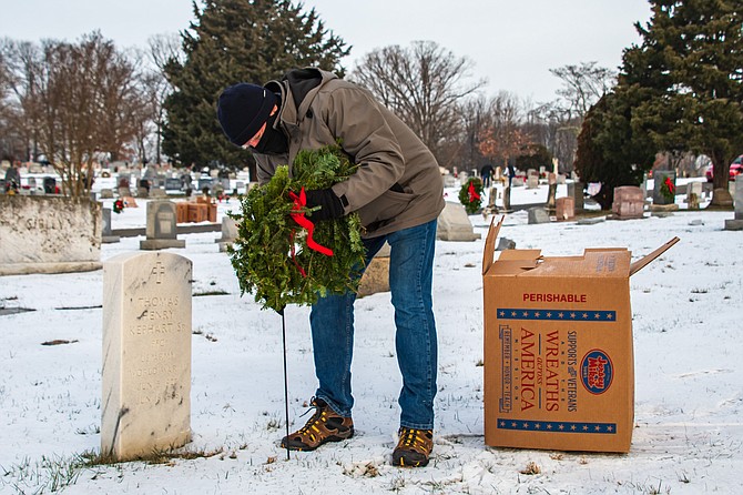 A remembrance wreath is placed at the gravesite of Private First Class United States Army World War II veteran Thomas Henry Kephart Sr. on Wreaths Across America Day, Dec. 19, 2020, at Chestnut Grove Cemetery in Herndon.