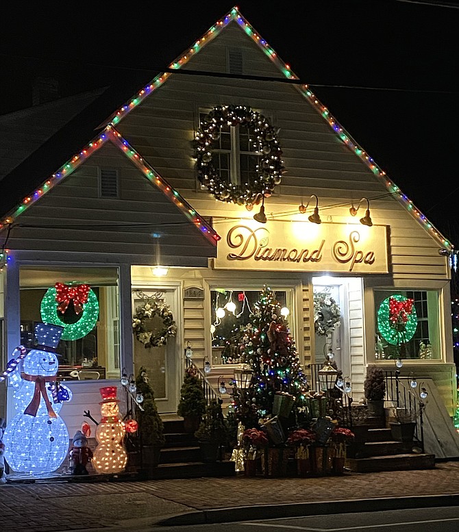 During the first days of January, holiday lights still shine bright outside a business in the Town of Vienna.